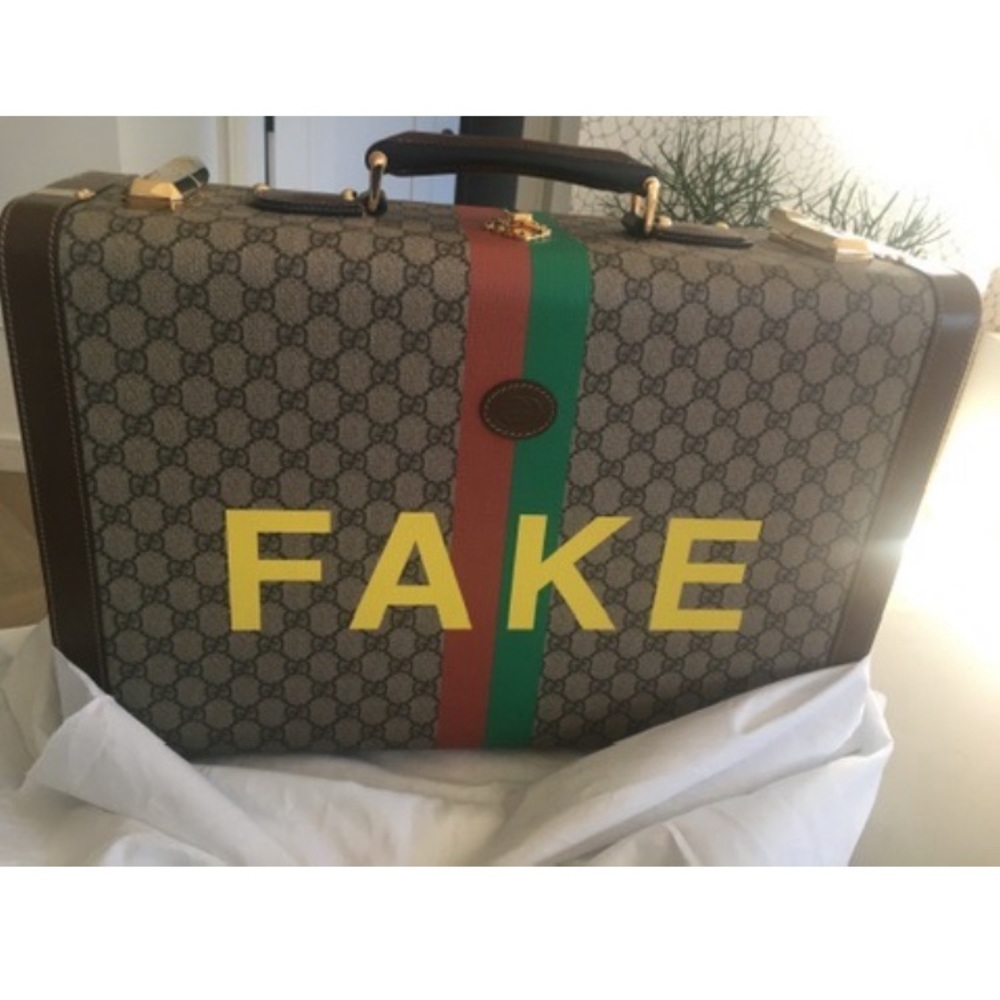 Gucci Not Fake Savoy Medium Suitcase with gold hardware.